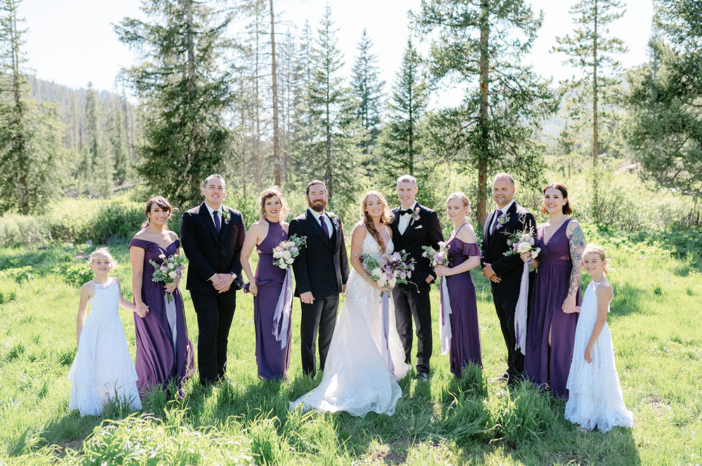 Piney River Ranch wedding party in a meadow