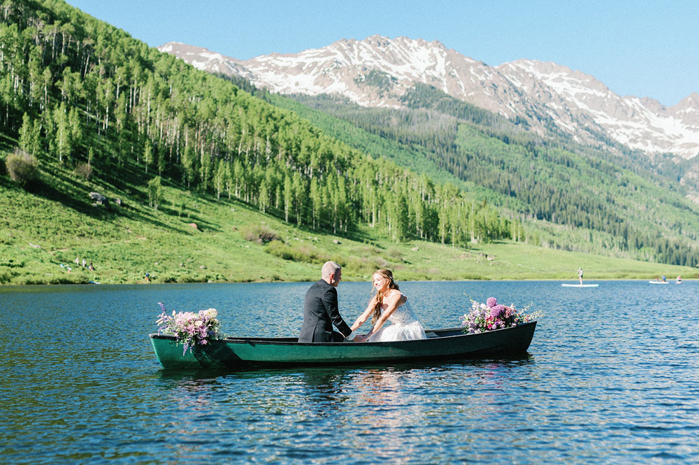 Piney River Ranch wedding couple in a canoe on the lake